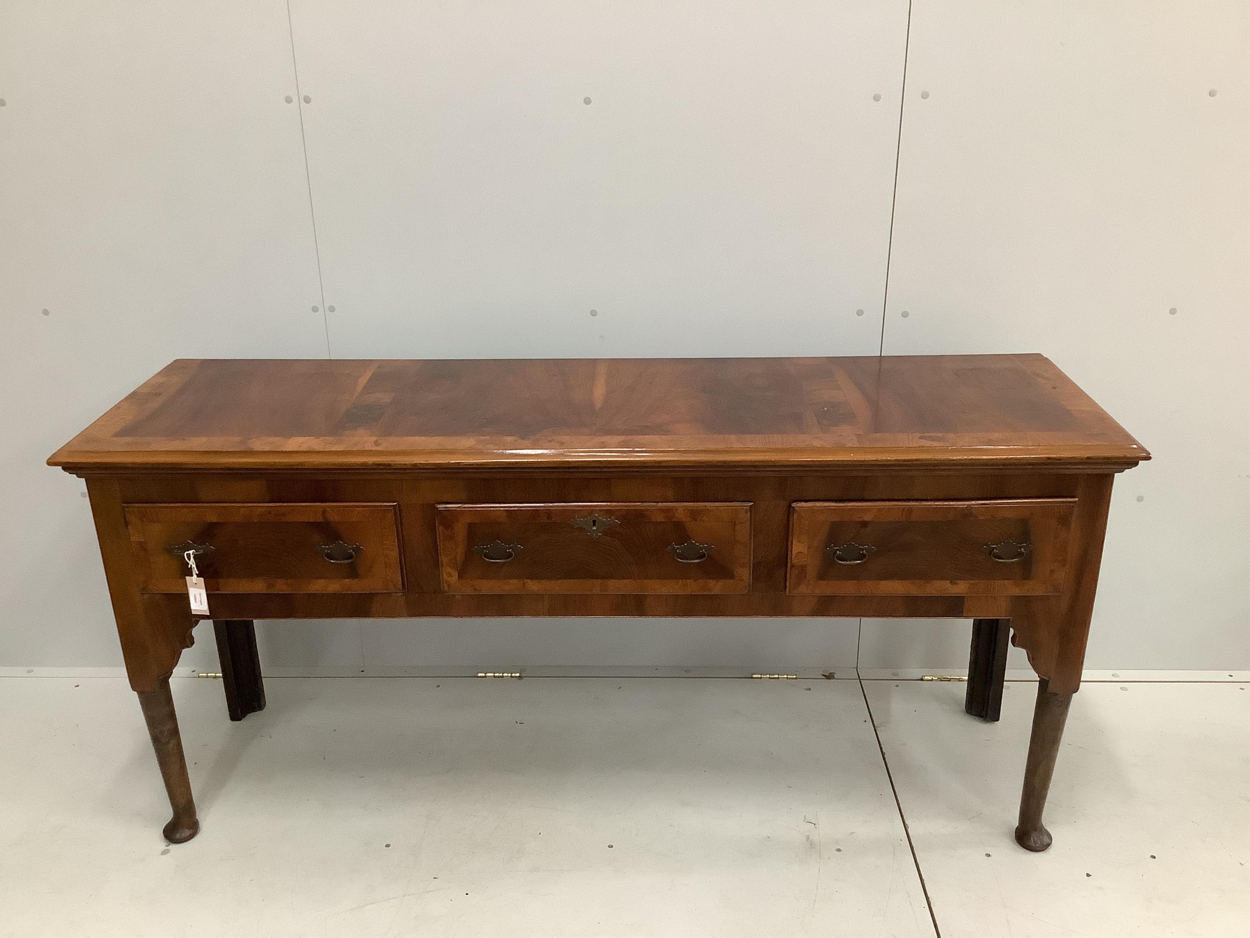 A George II style elm and burr walnut banded low dresser, width 182cm, depth 51cm, height 85cm. Condition - good